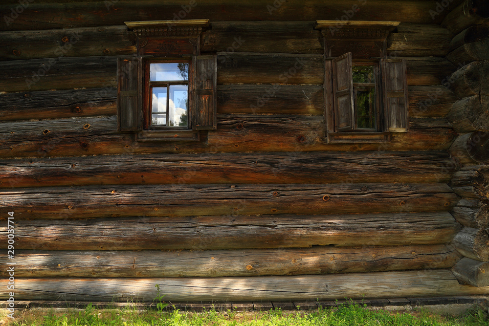 Wall with windows an old log house, Russia. Wall with windows an old log house, Russia.