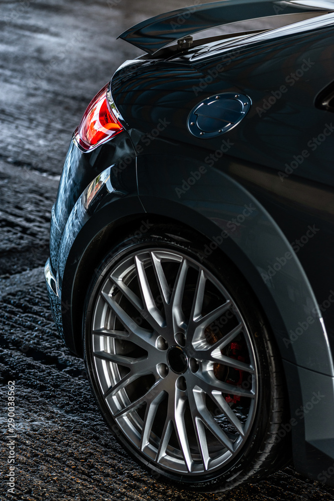 Dark, Moody Close up of back of the sports car wheel  