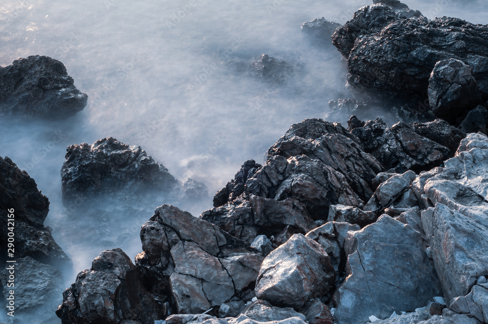 Beautiful stones, rocks and sea in a mystical haze at sunset. Long exposure. cool light landscape. Turkey. Aegean sea shore. Beautiful stones, rocks and sea in a mystical haze at sunset. Long exposure. cool light landscape. Turkey. Aegean sea shore.