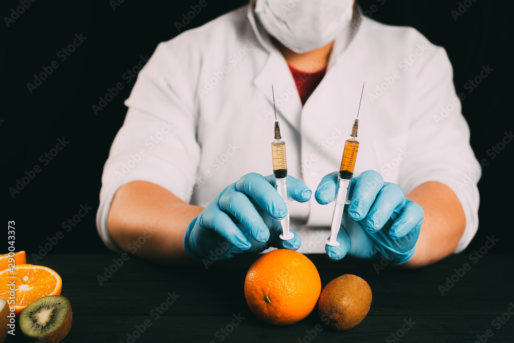 Injection of orange fruit. Isolated on white Injection of orange fruit. Isolated on white