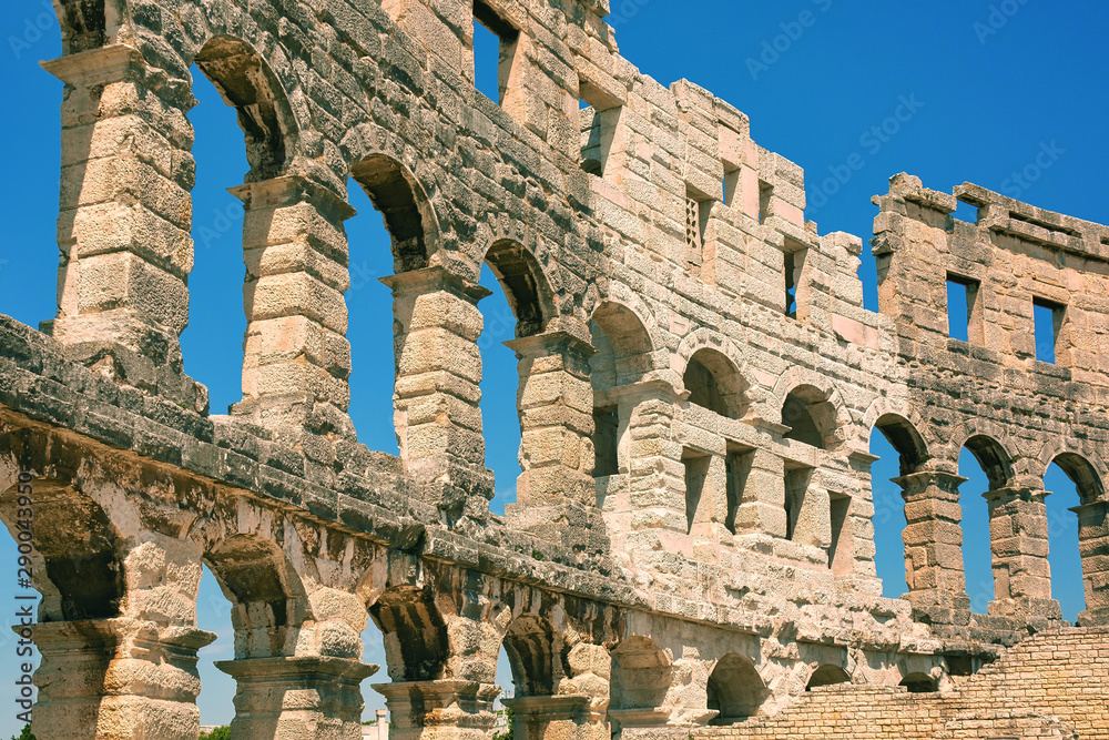 Ancient wall of amphitheater in Pula, Croatia. Historic heritage tourism and travel background