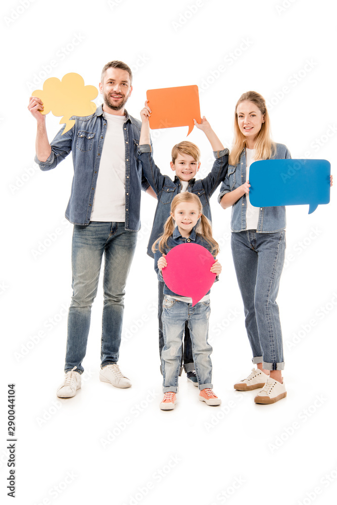 Fototapeta premium full length view of smiling family in jeans holding speech bubbles isolated on white