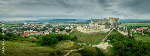 Aerial view of medieval Beckov castle with inner and outer courtyard, cannon tower, castle gate, chapel in Slovakia 