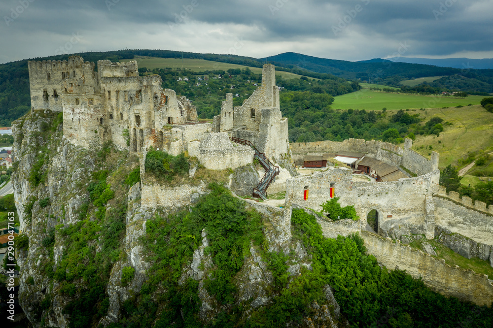 Aerial view of medieval Beckov castle with inner and outer courtyard, cannon tower,  castle gate, chapel in Slovakia 