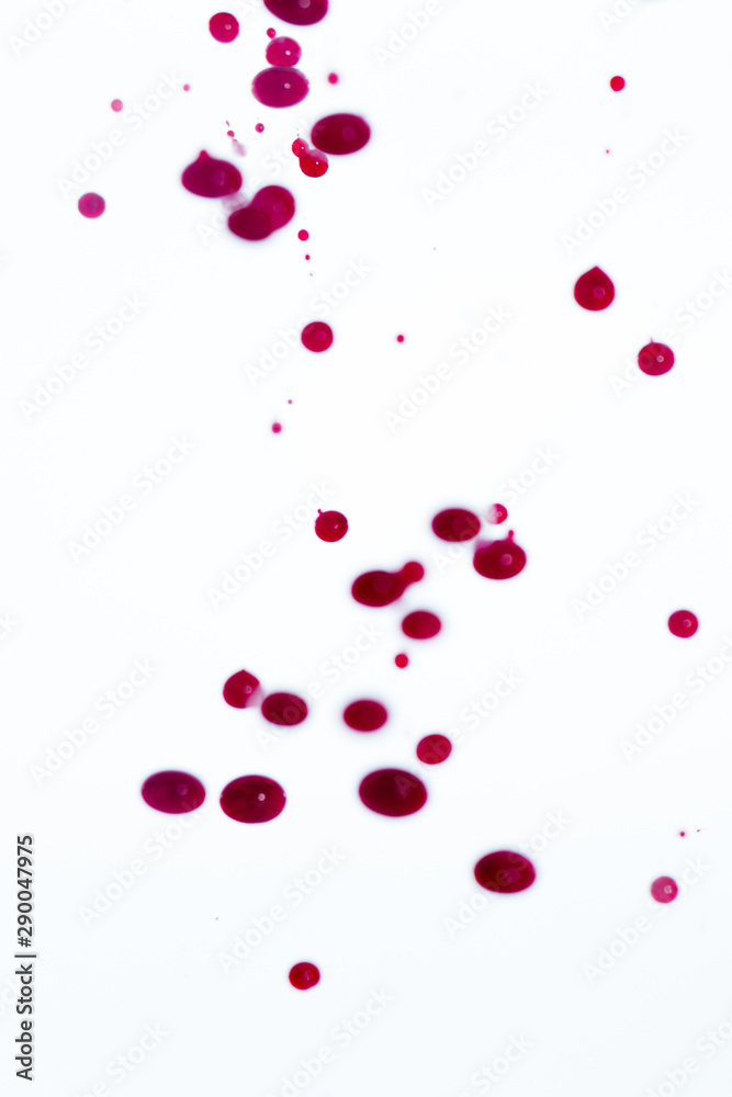 White background with abstract red drops