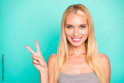 Close-up portrait of her she nice-looking attractive lovely gorgeous funny feminine cheerful cheery straight-haired girl showing v-sign isolated on bright vivid shine green turquoise background