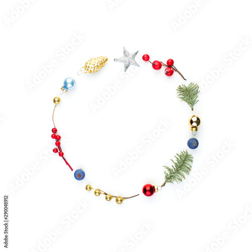 Christmas round composition frame with holly berries, silver star and green fir branch isolated on white background. Xmas flat lay top view