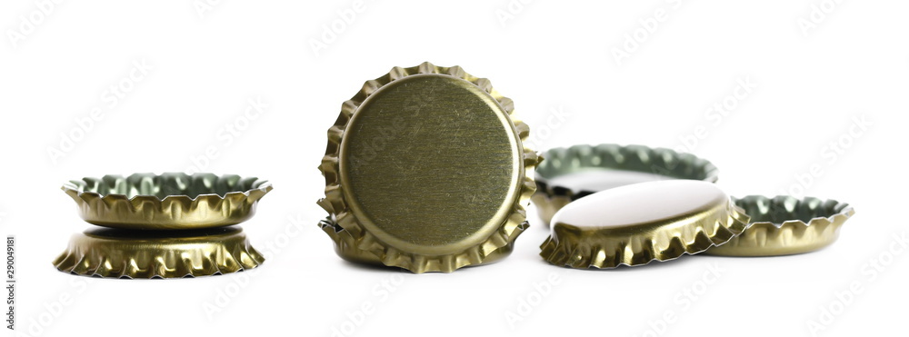 New golden bottle cap for beer isolated on white, side view, macro New golden bottle cap for beer isolated on white, side view, macro