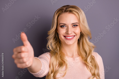 Close-up portrait of her she nice attractive lovely charming cute content cheerful cheery wavy-haired girl giving thumbup ad advert isolated over gray violet purple pastel color background © deagreez