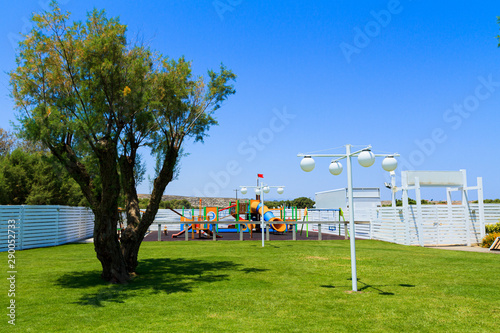 Children's wooden playground recreation area at public park © Stockphototrends