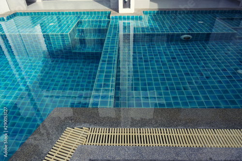 Swimming pool with stairs and colours tiles