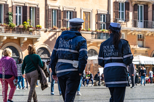 Italian police officers. Rear view