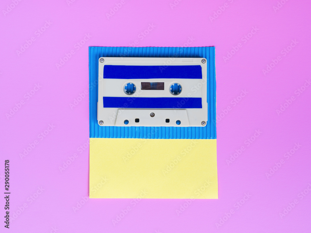 Fototapeta premium Vibrant cassette tape on bright wallpaper