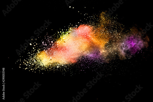 Abstract powder splatted background. Colorful powder explosion on black background. Colored cloud. Colorful dust explode. Paint Holi.