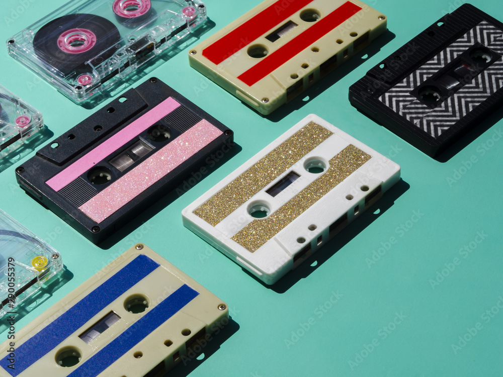 Multicolored cassette tapes collection in spotlight Multicolored cassette tapes collection in spotlight