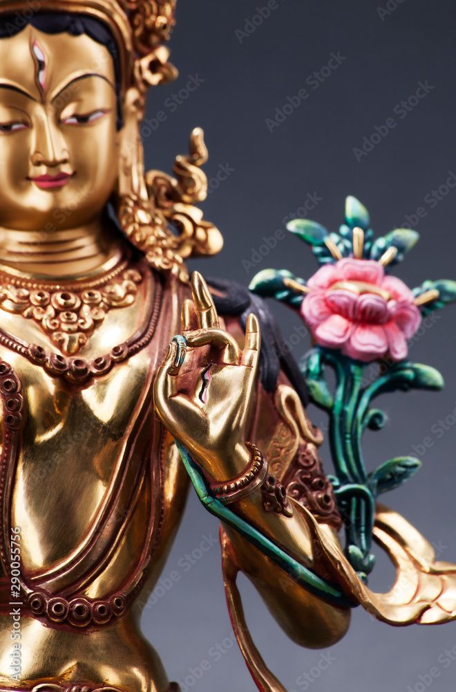 Fototapeta premium Gilded form of Green Tara Executed in the Tibetan tradition.