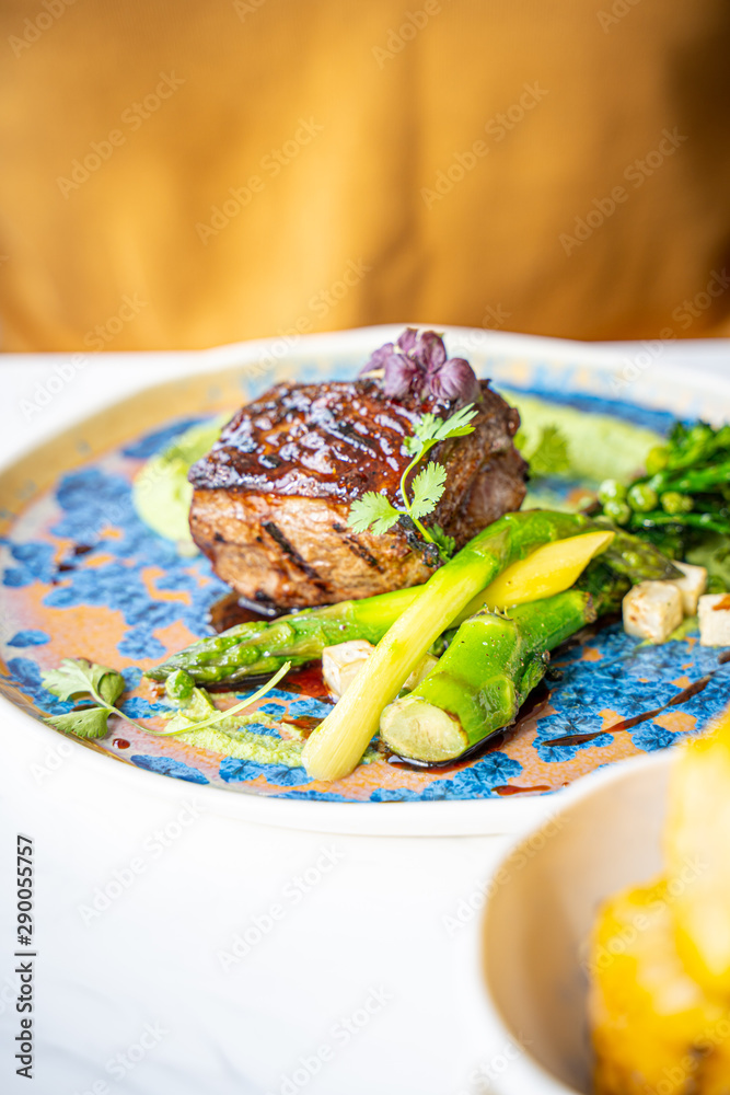 Steak with Vegetables and Red Vine in Luxury Restaurant for Dinner