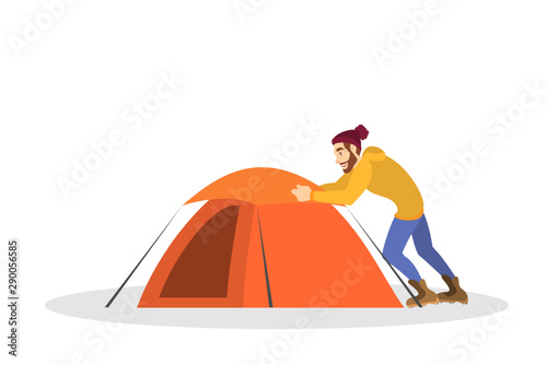 Man camper install tent in the park