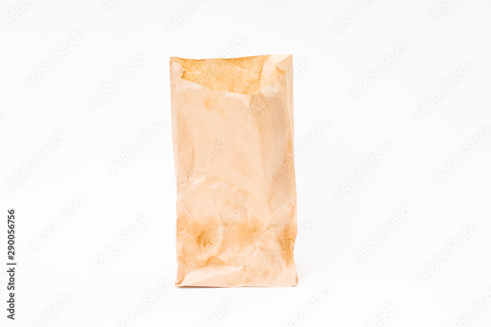 Crumpled brown paper bag on white background Crumpled brown paper bag on white background
