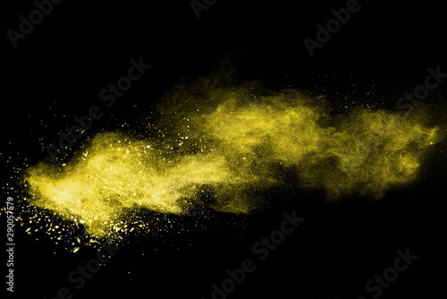 Fototapeta Naklejka Na Ścianę i Meble -  Yellow powder explosion on black background.