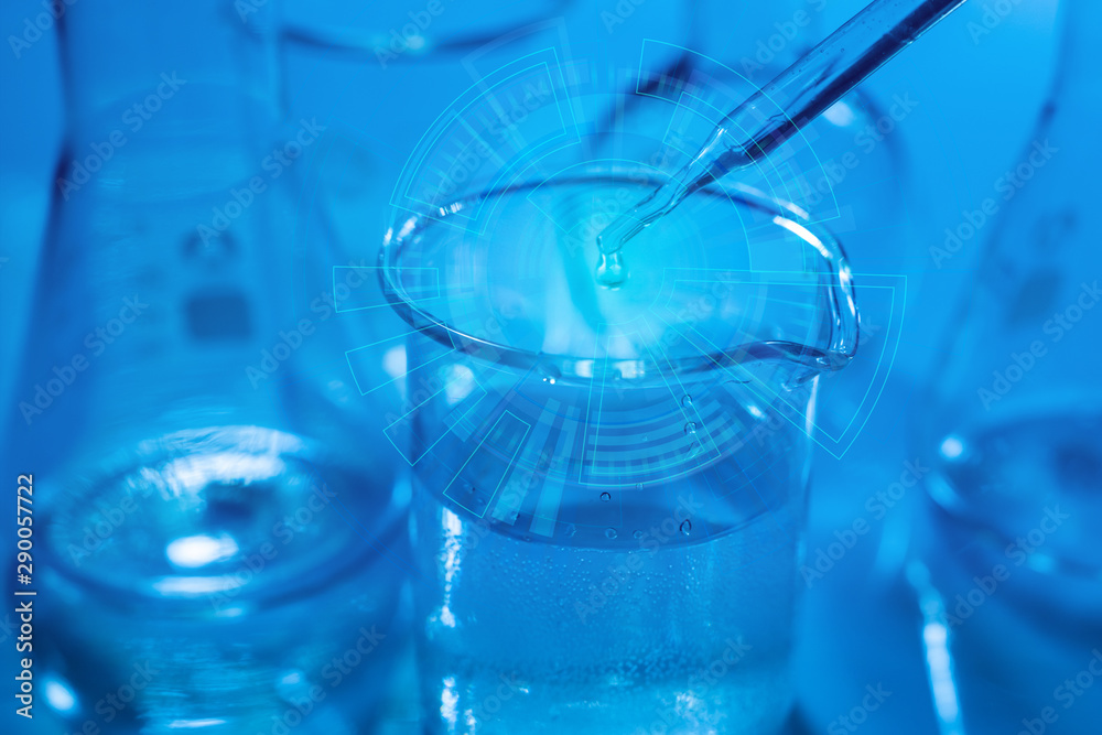 Researcher is dropping the reagent into test bigger. Biotechnology concept with scientist in lab Researcher is dropping the reagent into test bigger. Biotechnology concept with scientist in lab
