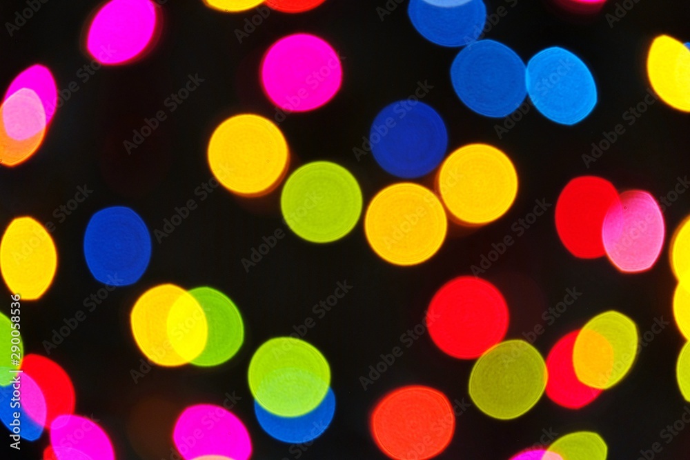 Bokeh lights background. Abstract multicolored light. Defocused fairy lights background. Christmas or New Year concept for background.