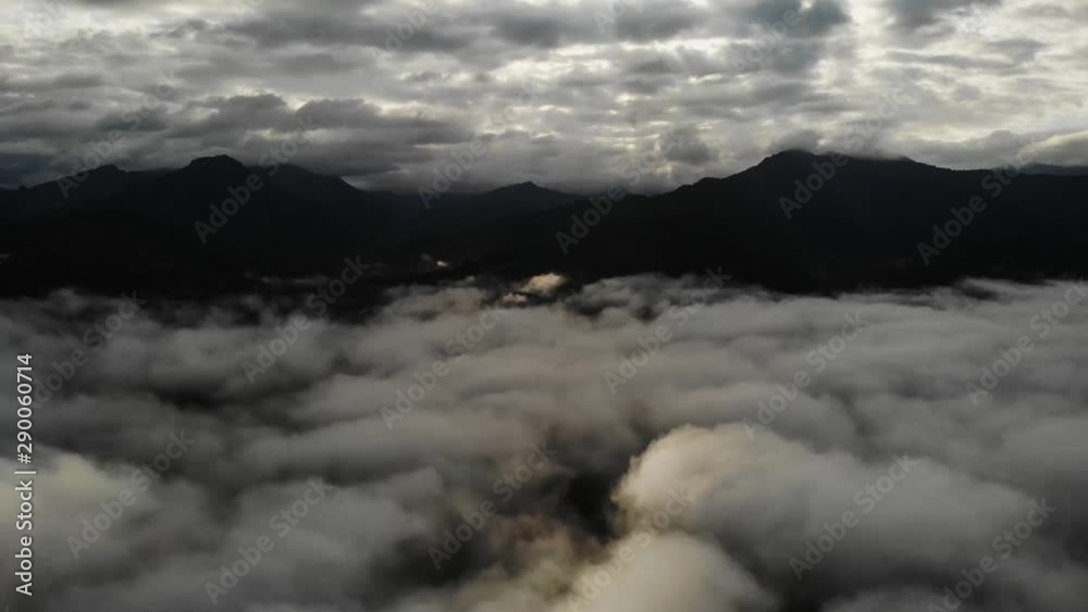 View from a drone flying over a cloud in the morning With the mountainous environment. View from a drone flying over a cloud in the morning With the mountainous environment.