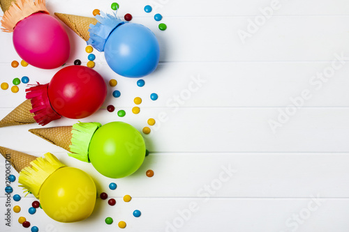 Colorful balloons ice cream on white background with copy space