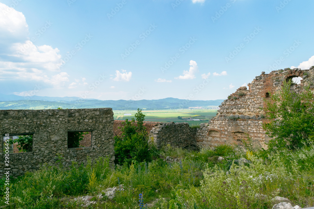 view of old ruins of the Rasnov Fortress deteriorated walls
