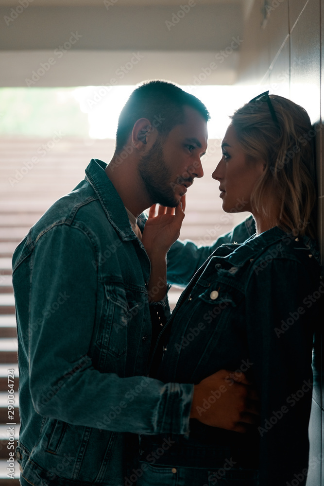 Sensual couple kissing in underground crossing Sensual couple kissing in underground crossing
