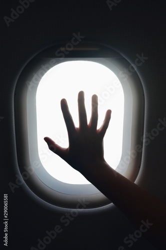 hand in airplane window