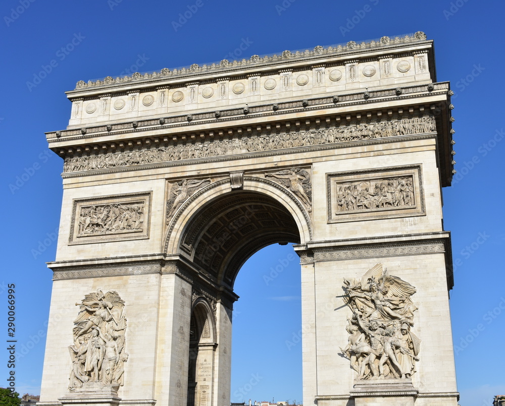 Arc de Triomphe from Champs Elysees with blue sky. Paris, France.