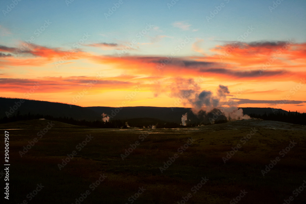 erupt geysers at dusk, Yellowstone, Wyoming