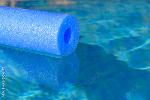 pool noodle floating on water