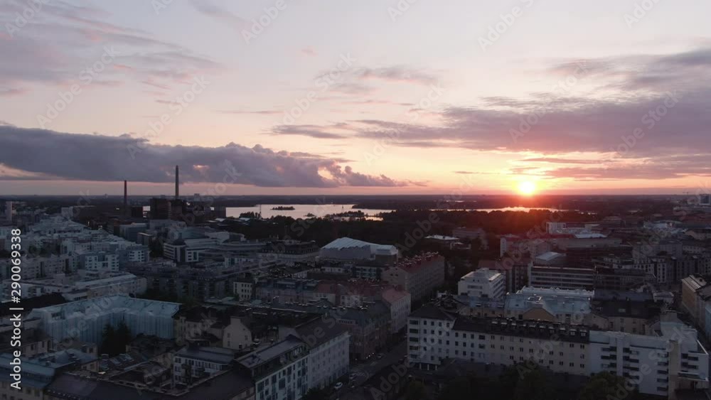 Sun. Flying over the city center of Helsinki during sunset. Finland golden sky. Downtown aerial drone shot. Sun. Flying over the city center of Helsinki during sunset. Finland golden sky. Downtown aerial drone shot.