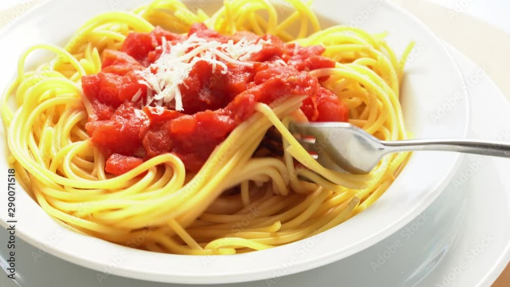 spaghetti with tomato sauce and ingredients on the kitchen table spaghetti with tomato sauce and ingredients on the kitchen table