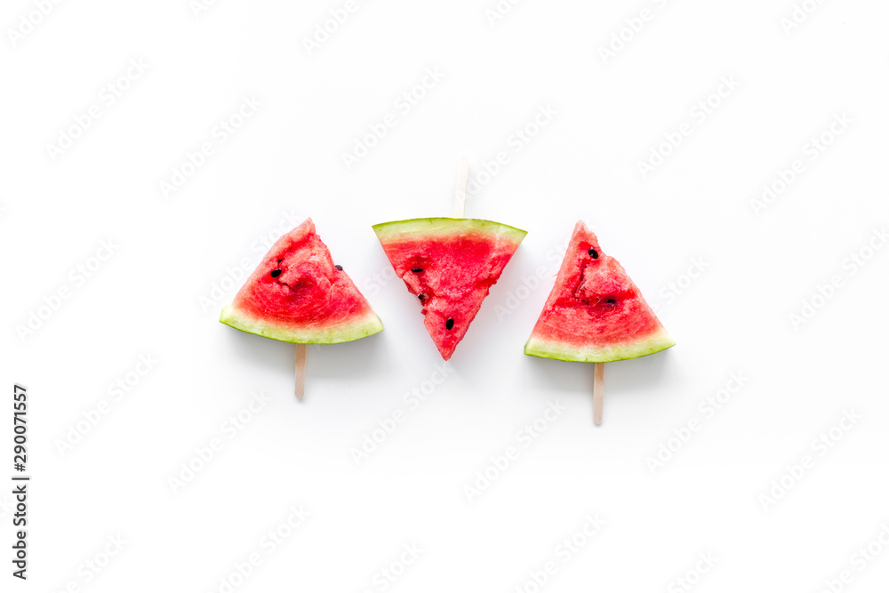 Popsicle from fresh watermelon on white background top view