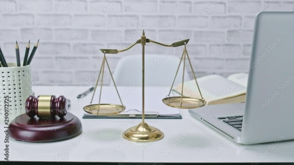 Slow motion of Gold brass balance scale on Law desk. Slow motion of Gold brass balance scale on Law desk.