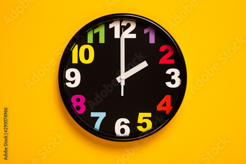 colorful wall clock show two o'clock