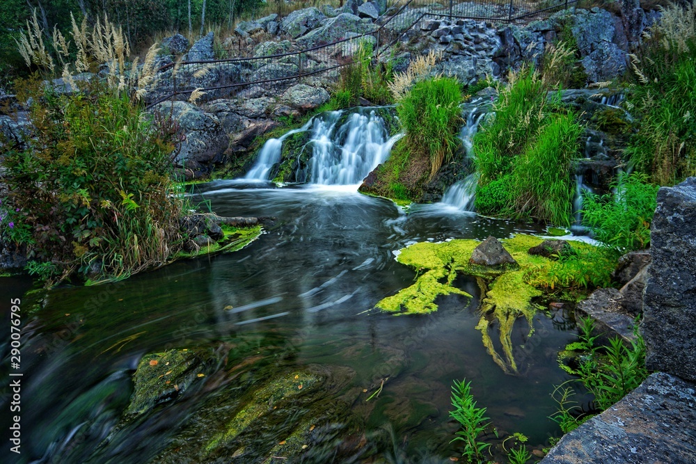 Naklejka premium Waterfall in small river