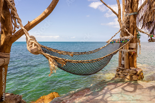 Empty hammock on beautiful tropical beach near sea water Thailand © OlegD