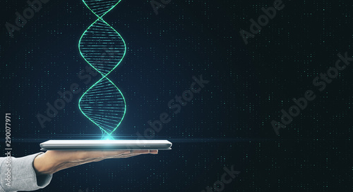 Genetic science and biotechnology concept with human hand with digital tablet and dna spiral. photo