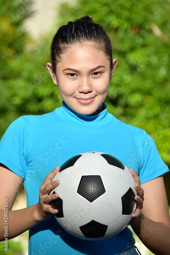 Female Soccer Player Portrait With Soccer Ball © dtiberio