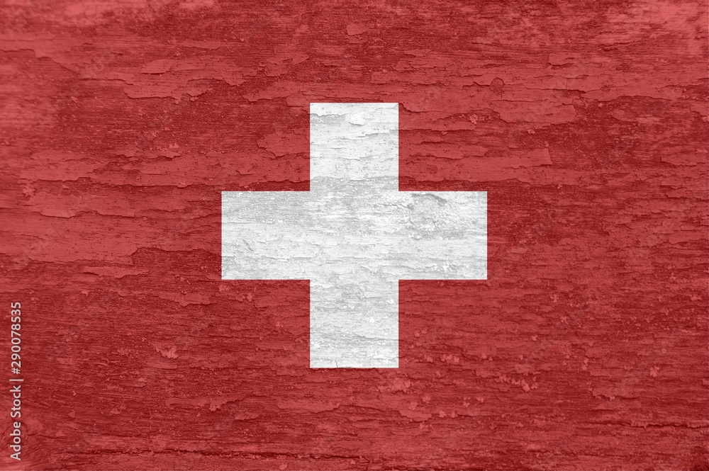 Switzerland flag on an old painted wooden surface. Switzerland flag on an old painted wooden surface.