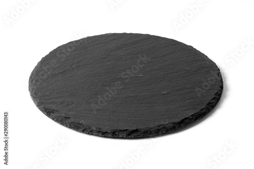 Black round stone plate isolated on white