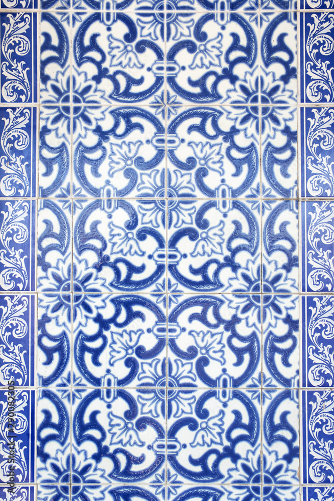 Traditional ornate portuguese decorative tiles azulejos in white and blue colours.
