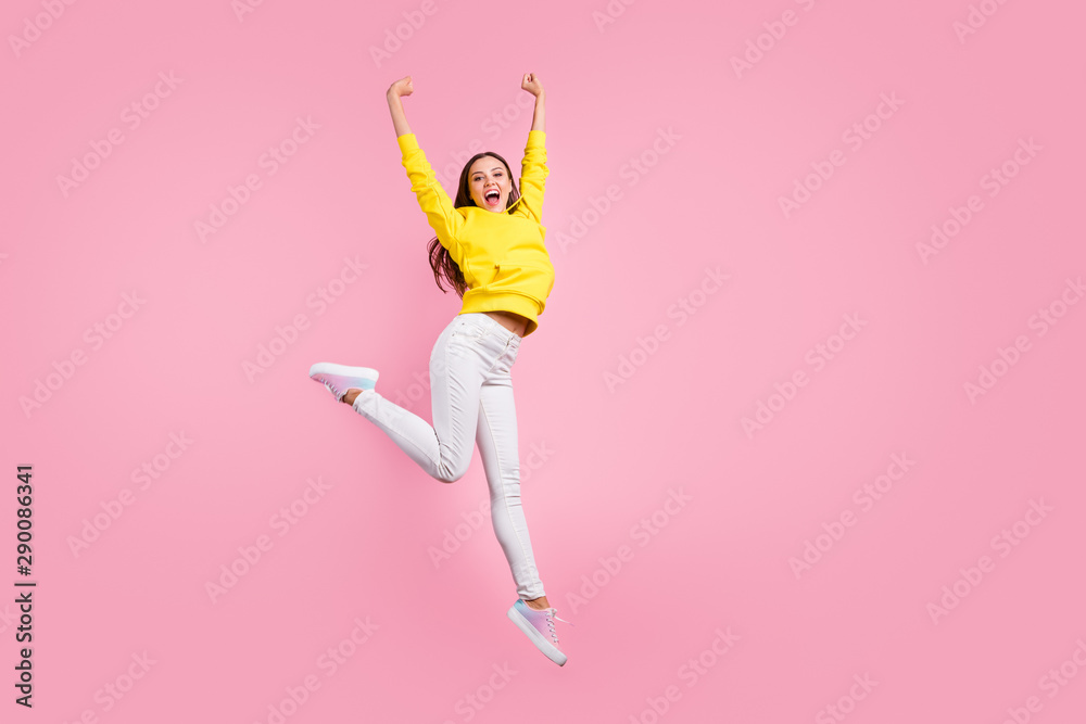 Full length body size photo of cute charming nice pretty sweet girlfriend having reached finish line first raising hands up wearing yellow sweater isolated over pink pastel color background Full length body size photo of cute charming nice pretty sweet girlfriend having reached finish line first raising hands up wearing yellow sweater isolated over pink pastel color background