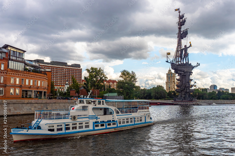 Russia.Center of Moscow.Motor ship in Moscow river.Water walking tours in Moscow. Excursion in the center of the capital.Walk along the promenade. Peter 1. Rest in Russia.Motor ship near the monument