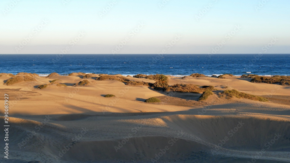 Tourists on the beach and the dunes of Maspalomas. Tourists on the beach and the dunes of Maspalomas.
