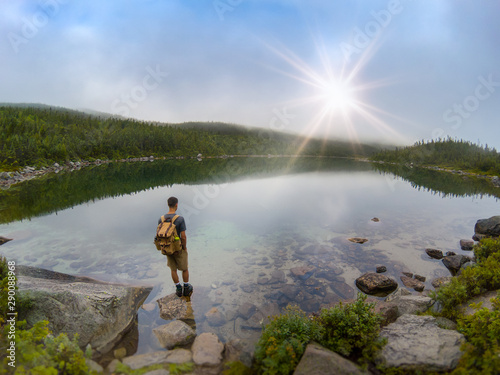 Hiker Visits Mountain Pond